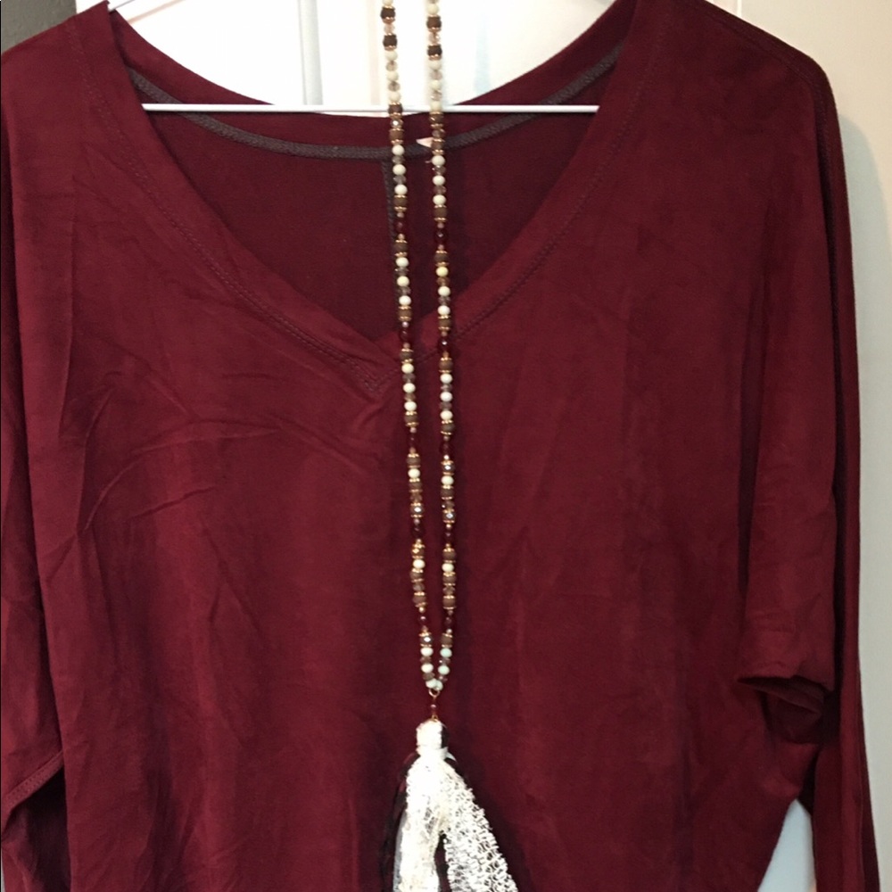 Style&Co brand; maroon V-neck small top; faux suede material;very comfortable.